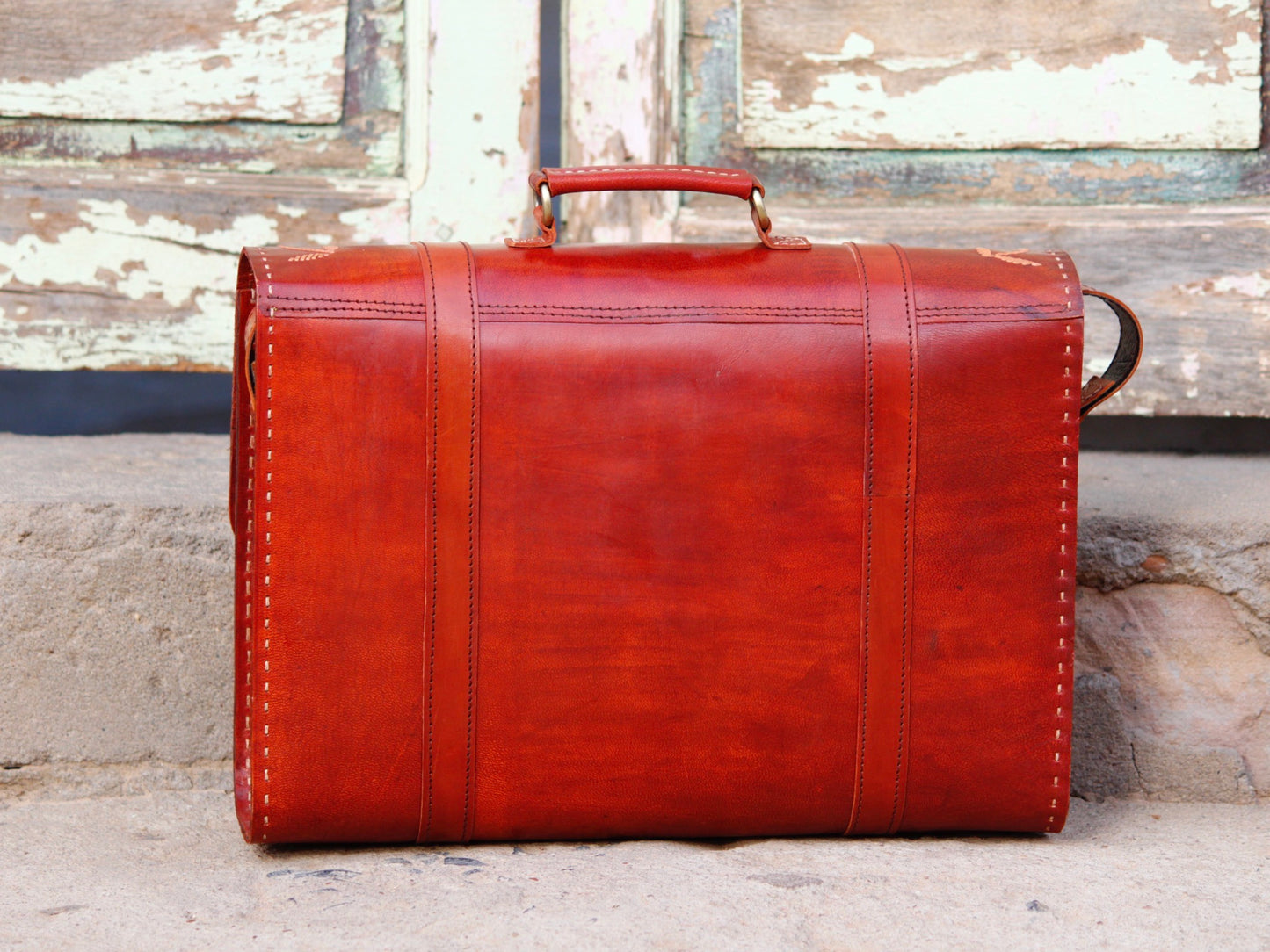 Handcrafted leather office bag showcasing decorative thread work and durable construction