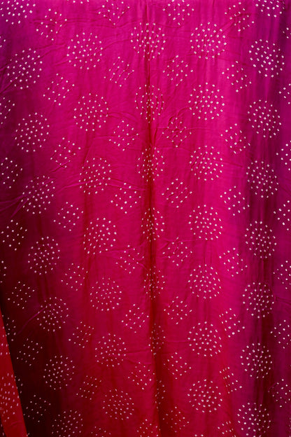 Handcrafted magenta Gajji silk saree showcasing authentic Bandhani artistry with rich zari detailing