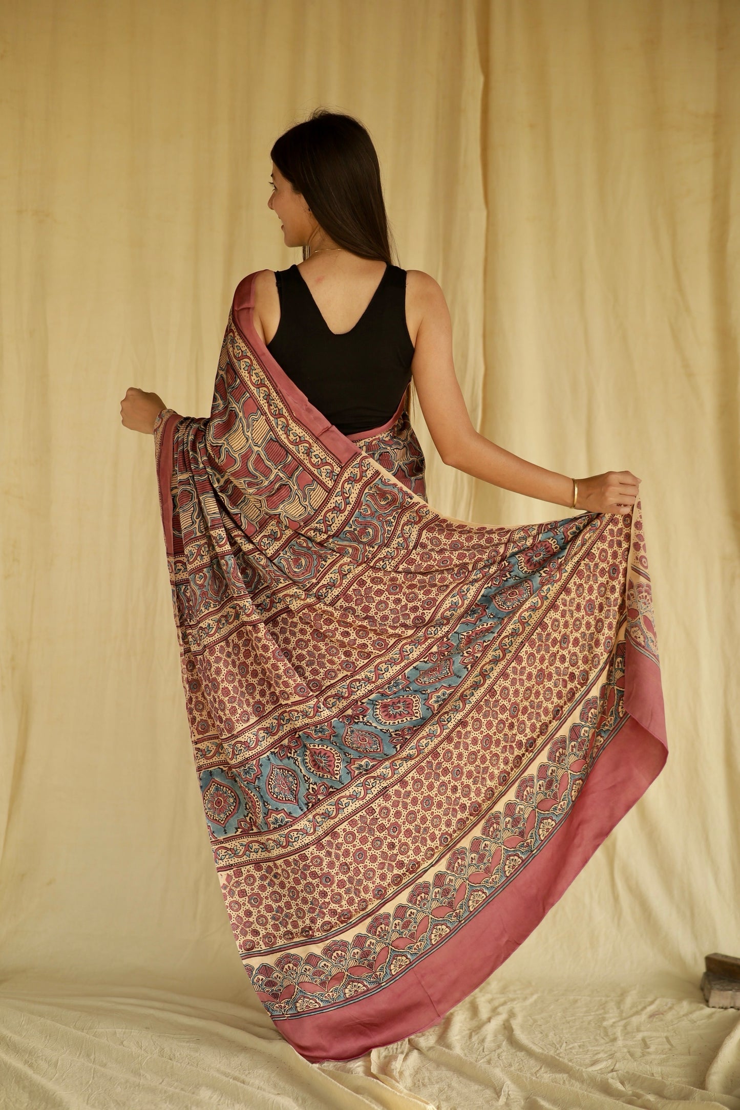 Traditional mauve pink Ajrakh printed modal silk saree crafted by skilled artisans with refined detailing