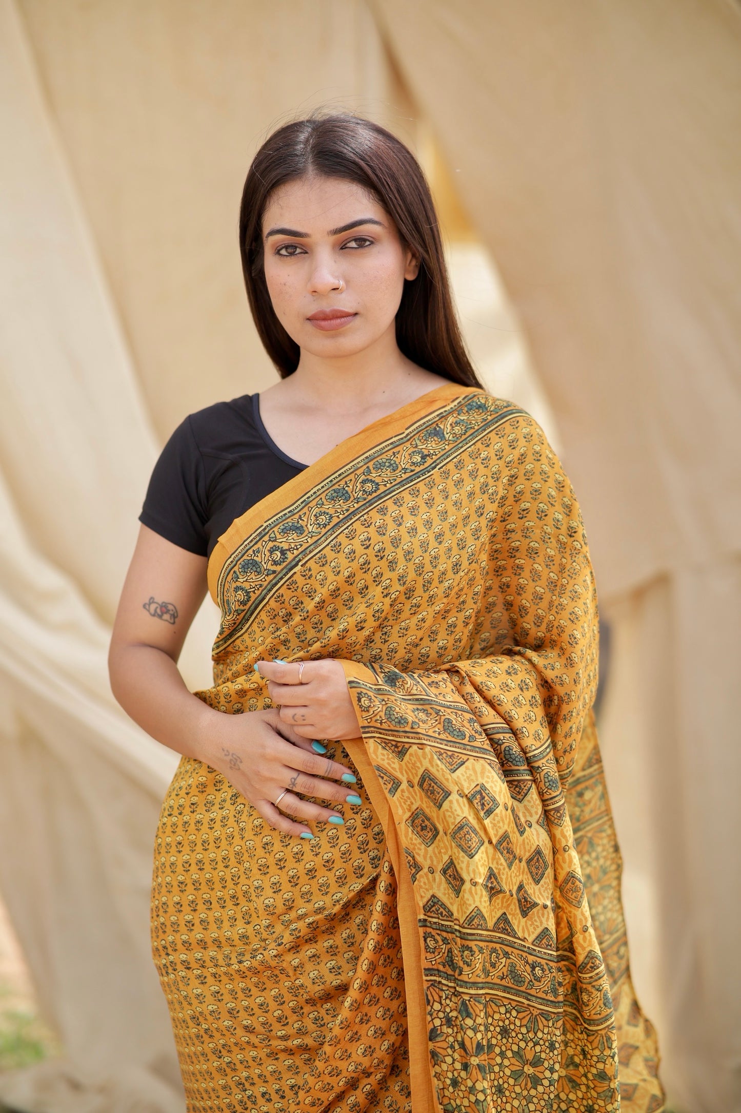 Traditional mustard yellow Ajrakh printed Chanderi silk saree crafted by skilled artisans with refined detailing