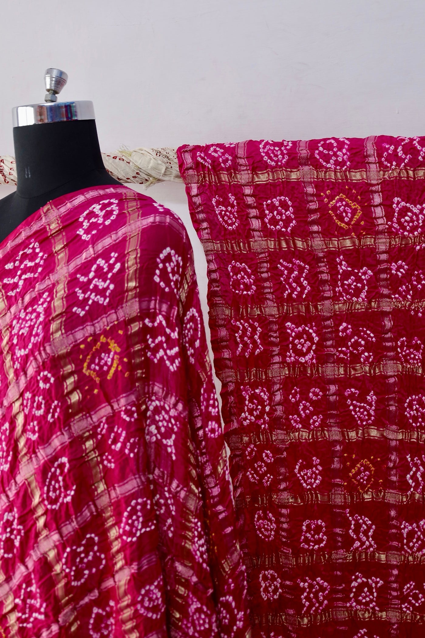 Traditional Bandhani Gharchola saree in rosewood tones crafted from luxurious Gajji silk
