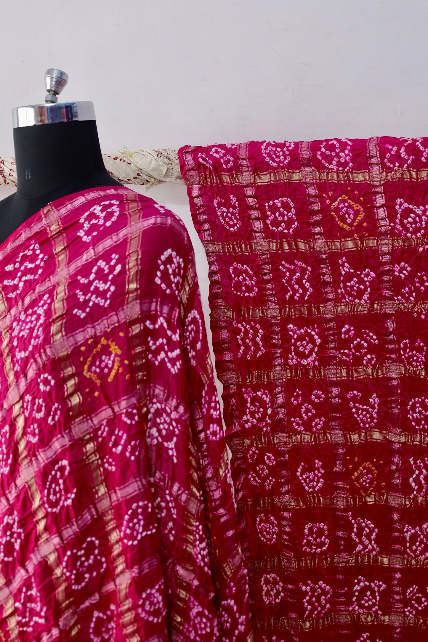 Traditional Bandhani Gharchola saree in rosewood tones crafted from luxurious Gajji silk