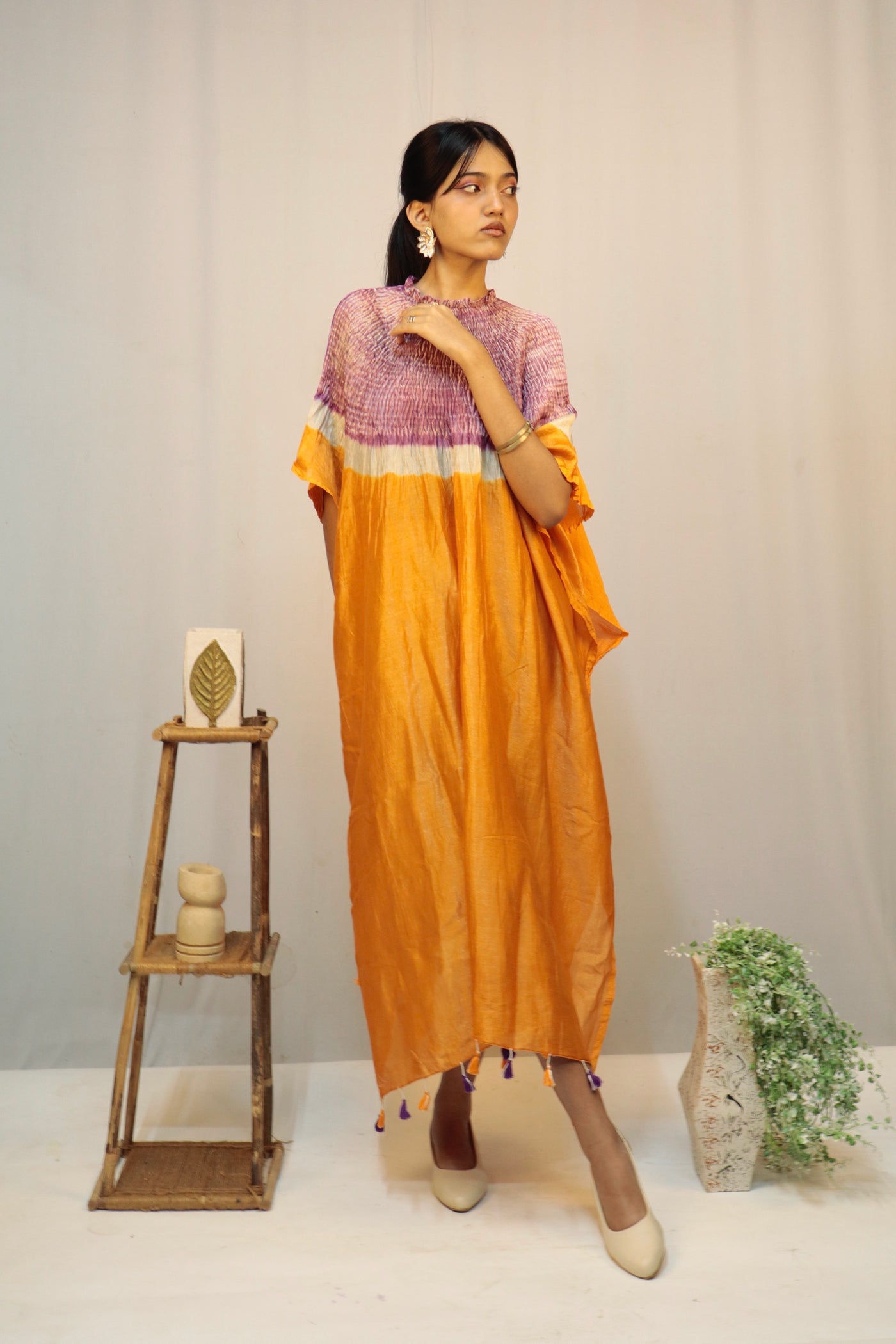 Elegant saffron fade Bandhani Shibori kaftan crafted with authentic artisan dyeing techniques
