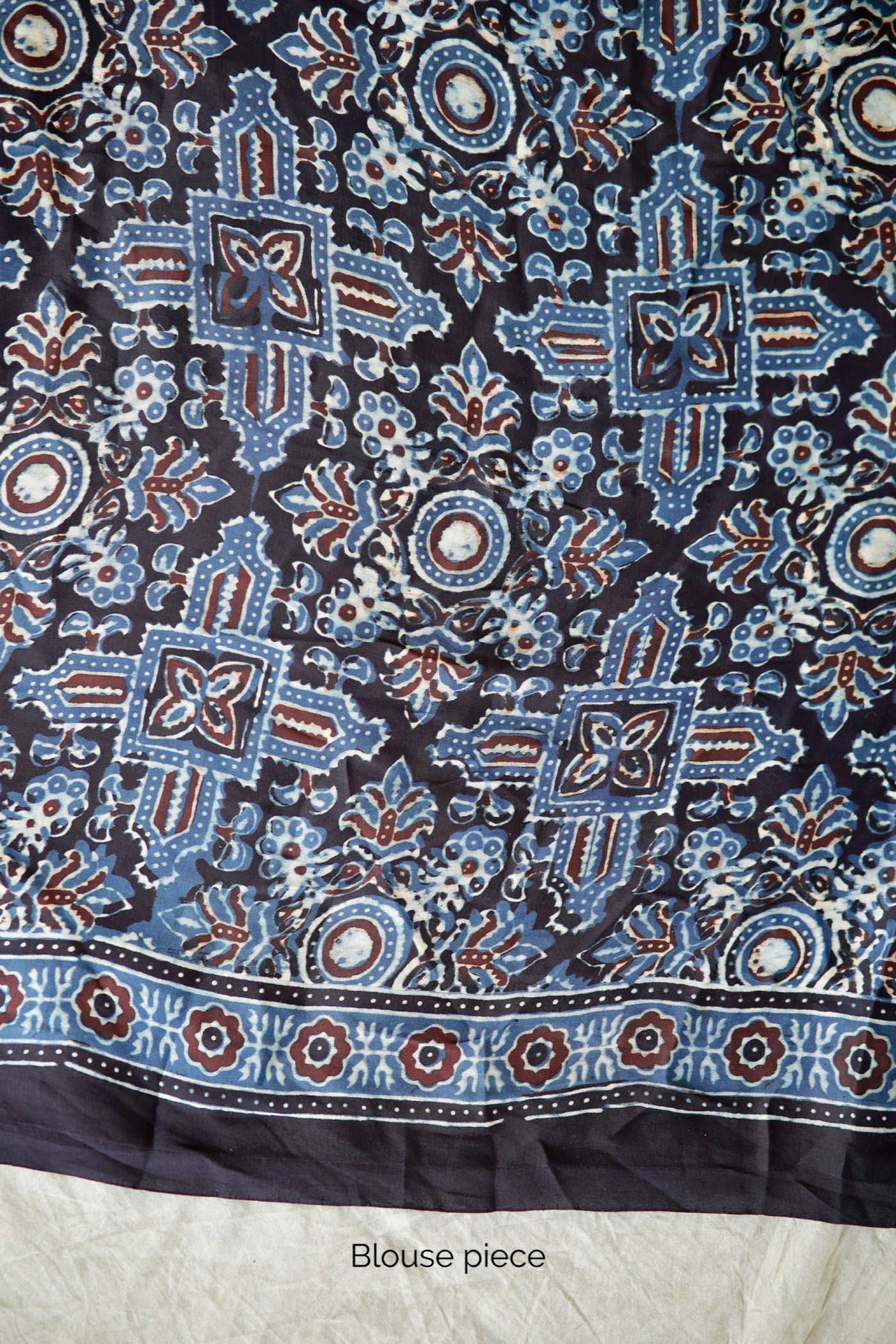 Traditional sapphire blue Ajrakh printed modal silk saree crafted by artisans with exceptional craftsmanship