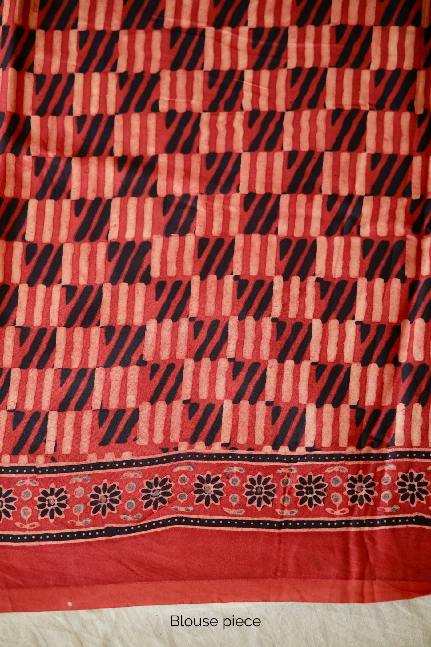 Traditional scarlet and black Ajrakh printed modal silk saree crafted by artisans with exceptional craftsmanship