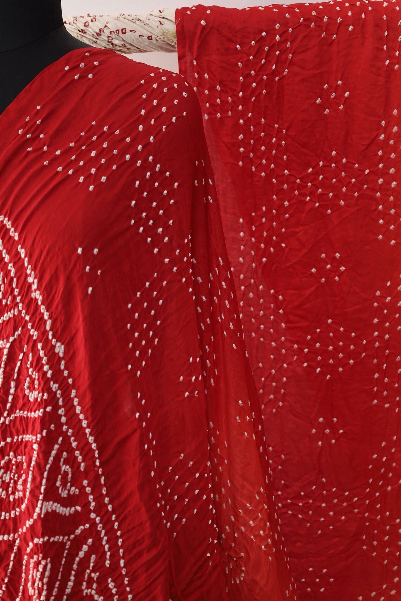 Handcrafted scarlet Gajji silk saree showcasing authentic Bandhani artistry with rich zari detailing