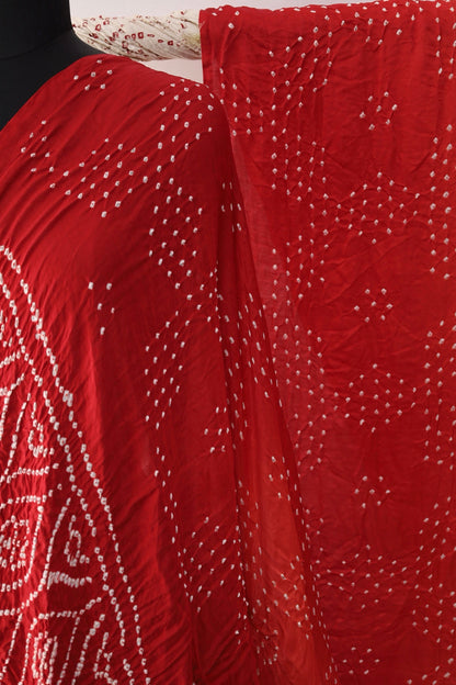 Handcrafted scarlet Gajji silk saree showcasing authentic Bandhani artistry with rich zari detailing