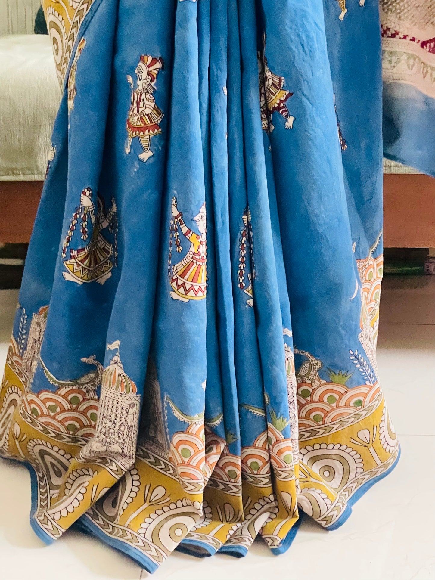 Premium sky gold handpainted saree reflecting the cultural richness and storytelling tradition of Mata Ni Pachedi art