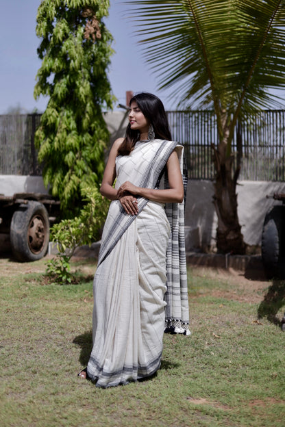 Premium slate Kala Cotton saree showcasing traditional Bhujodi textile artistry and timeless appeal