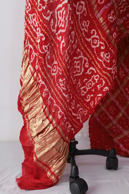 Traditional Gharchola saree with handcrafted Bandhani motifs and rich cultural detailing