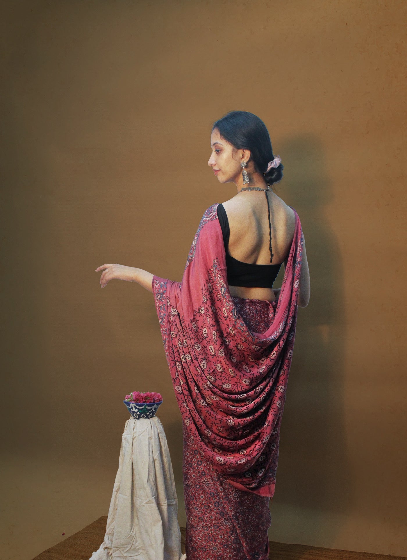 Premium wine pink modal silk saree with heritage-inspired Ajrakh designs and graceful texture