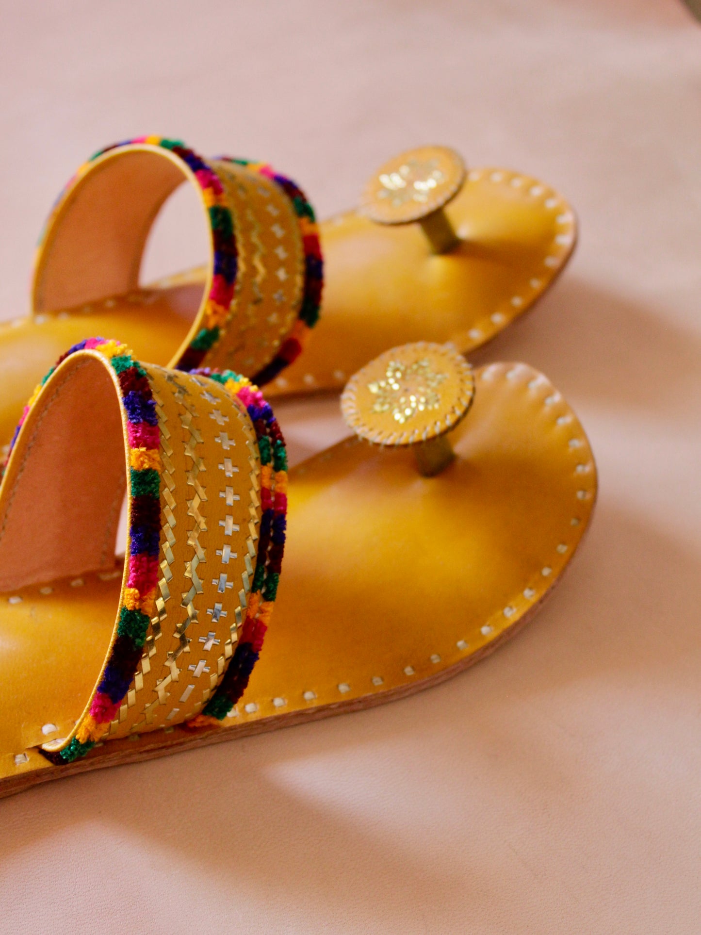 Premium yellow handcrafted leather flats with fine artisan stitching details
