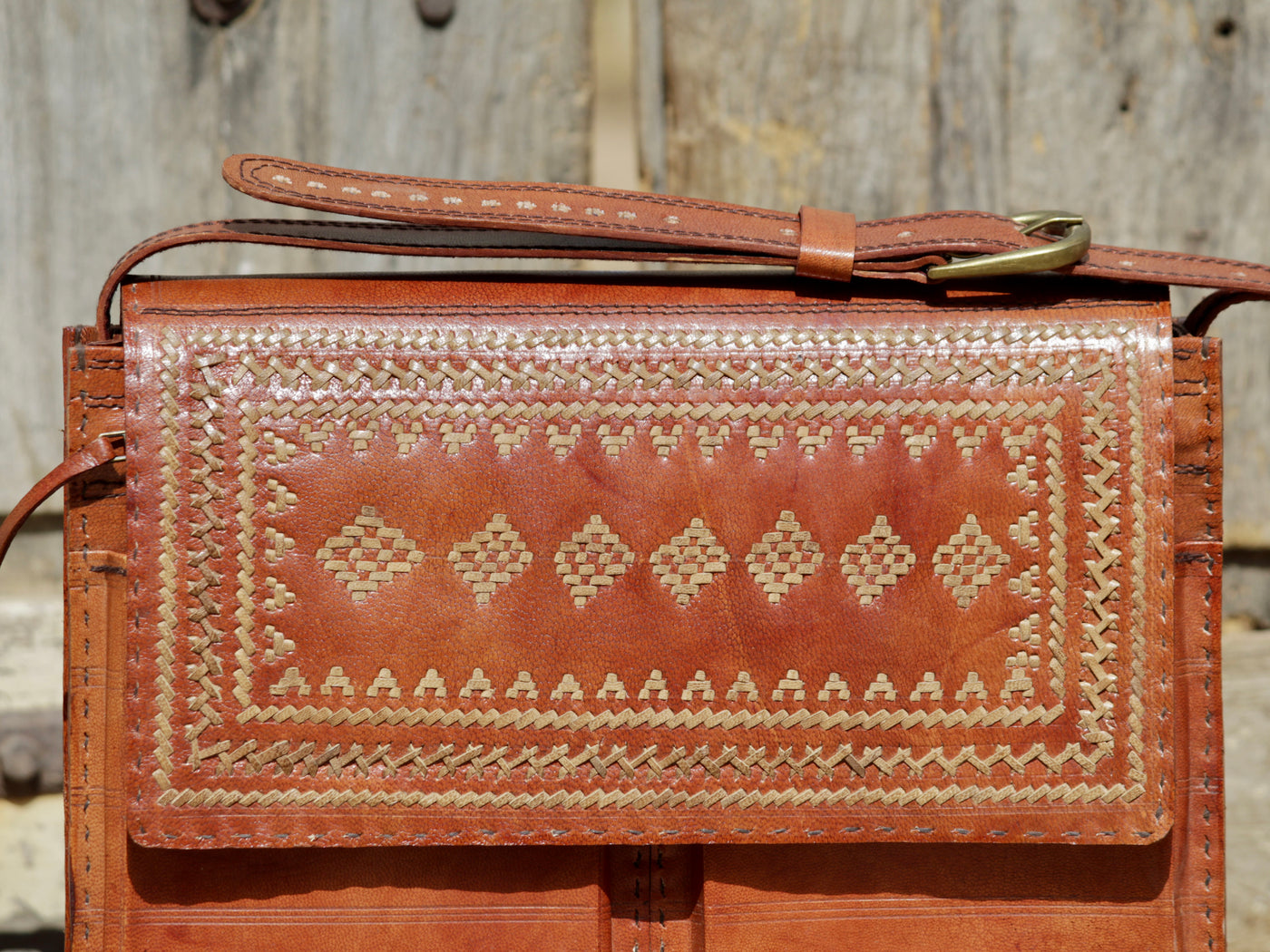 Leather office bag featuring intricate thread work on premium handcrafted leather