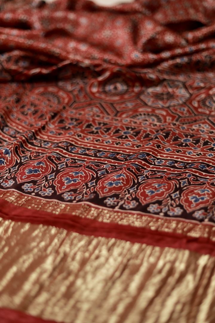 Handcrafted coral red Ajrakh dupatta made from premium modal silk with traditional Lagdi Patta detailing