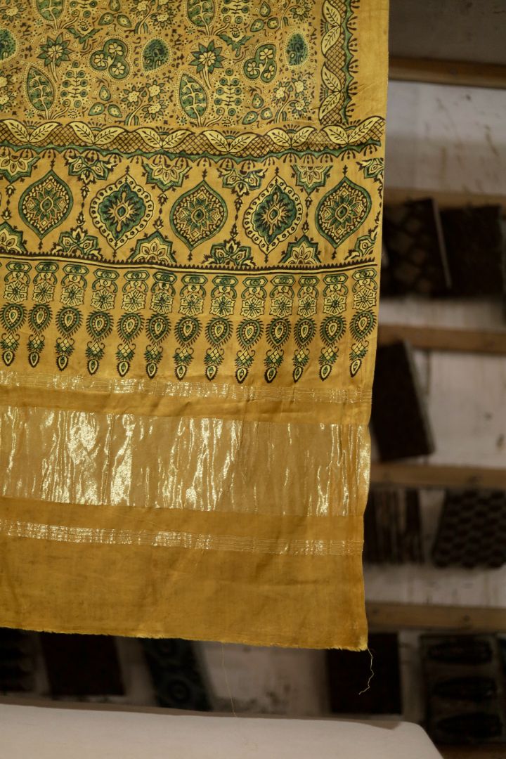 Traditional mustard gold Ajrakh modal silk dupatta showcasing authentic artisan craftsmanship and decorative borders