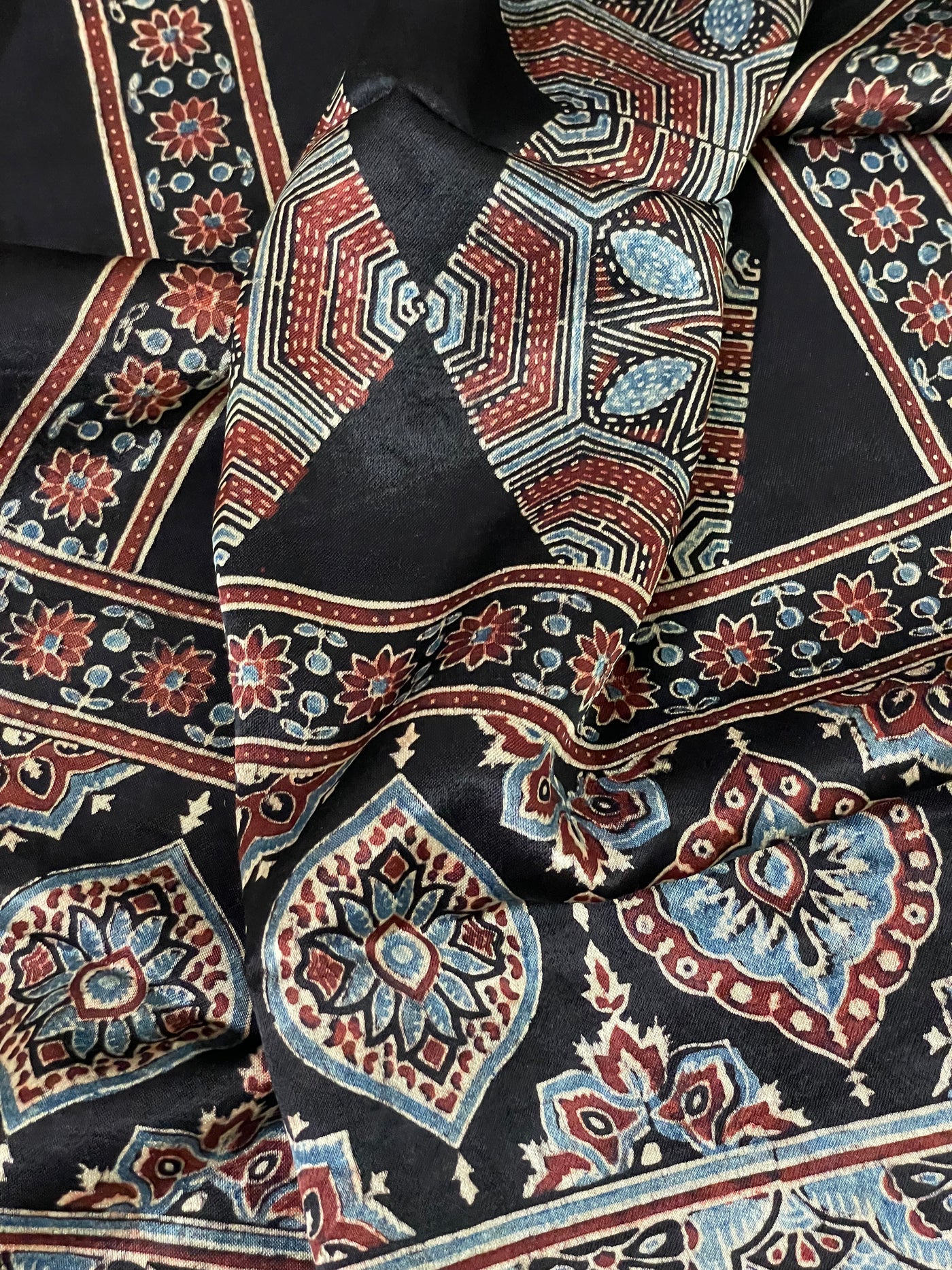 Premium rust black Ajrakh stole with heritage block print motifs and luxurious texture