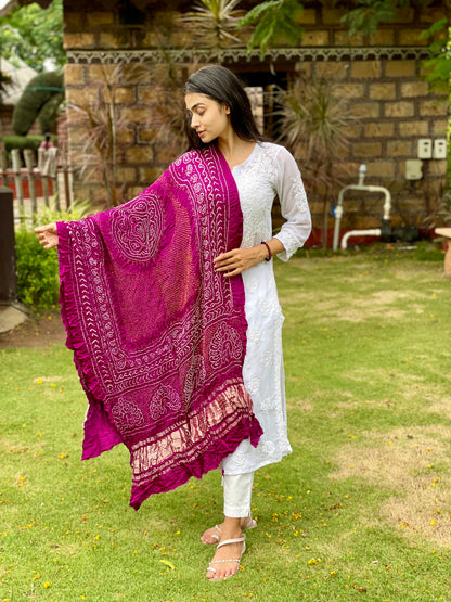 Rani pink Bandhani Gajji silk dupatta featuring traditional tie-dye craftsmanship and graceful drape