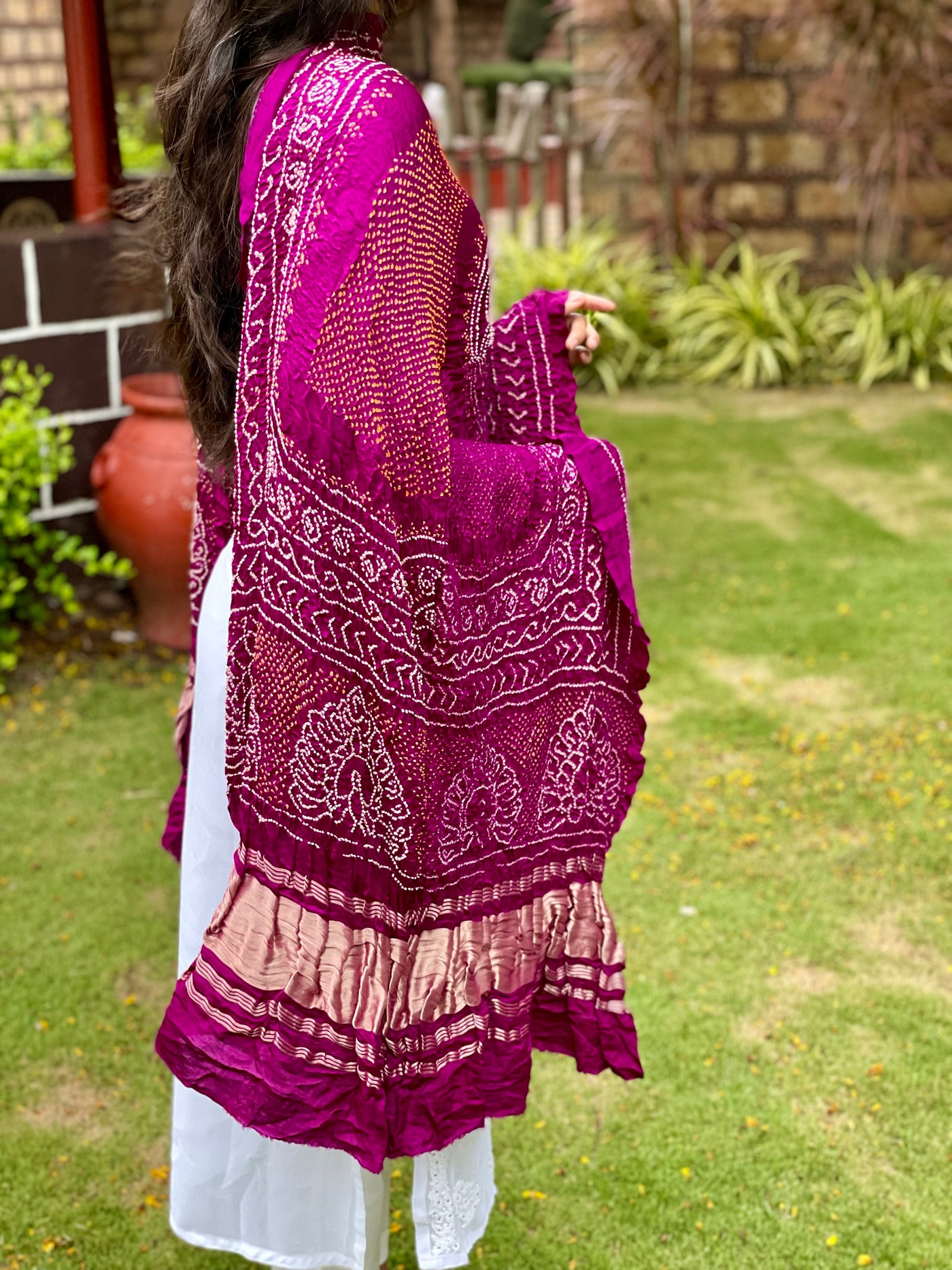 Traditional Rani pink Bandhani Gajji silk dupatta with intricate artisanal patterns