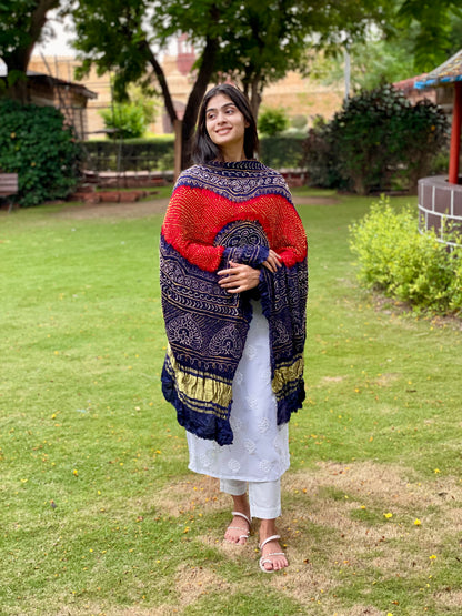 Red and ink blue Bandhani Gajji silk dupatta featuring traditional tie-dye craftsmanship and elegant drape