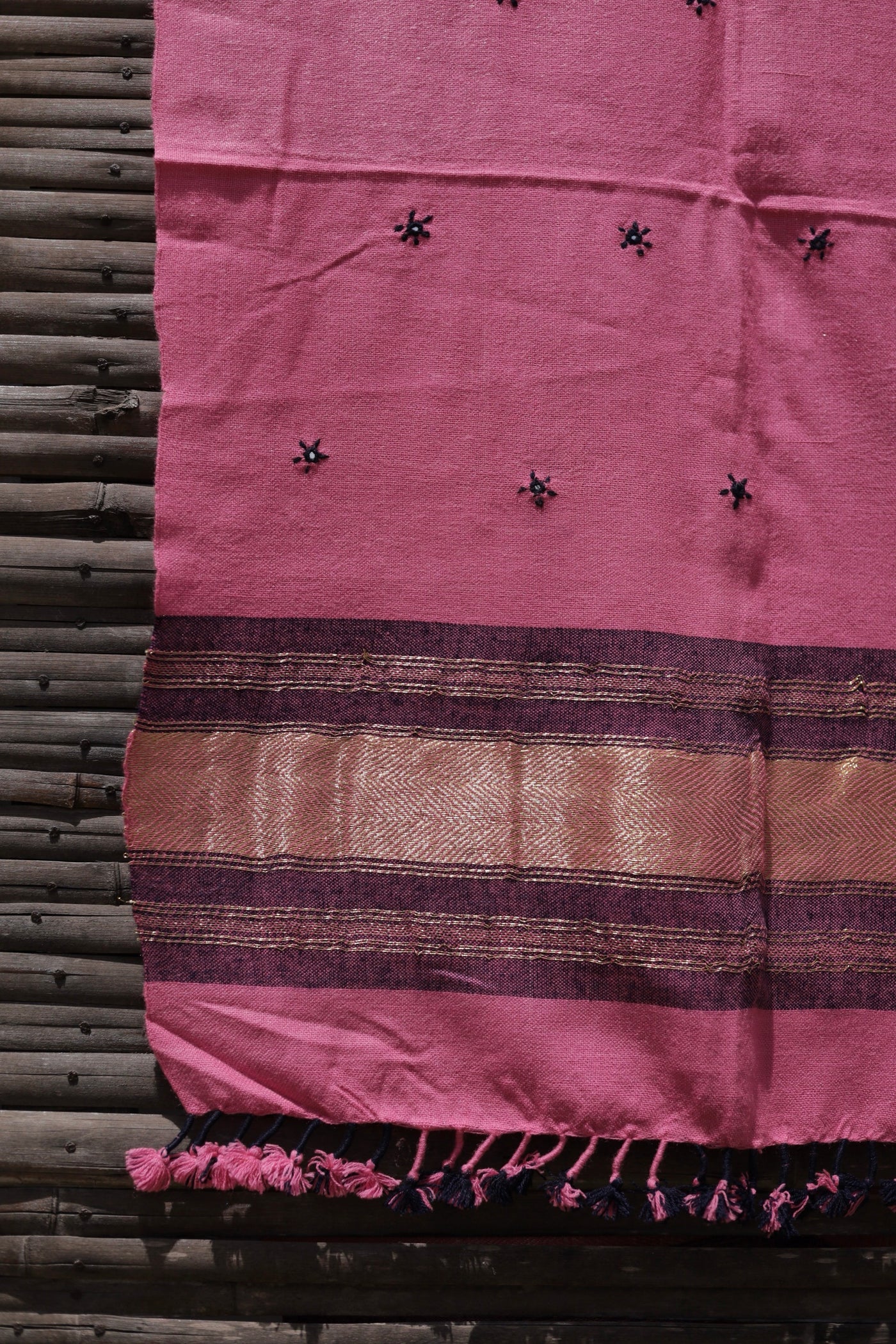 Rose blush handwoven woolen stole featuring a soft pink hue and fine artisan craftsmanship