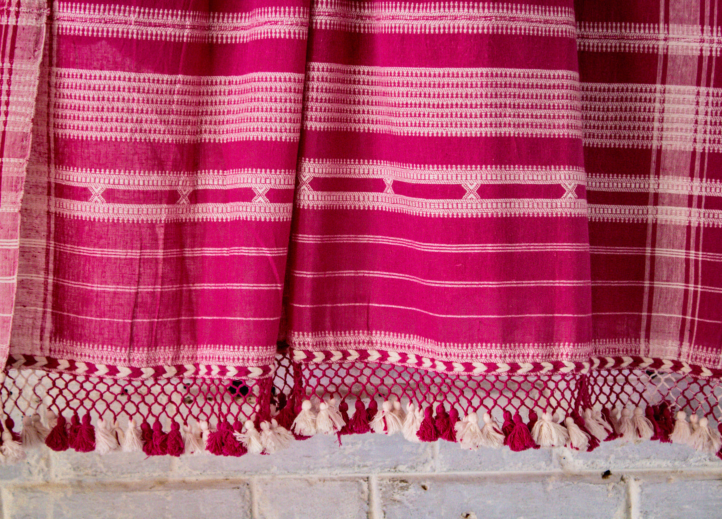 Premium rose Kala Cotton saree showcasing traditional Bhujodi textile artistry and timeless appeal