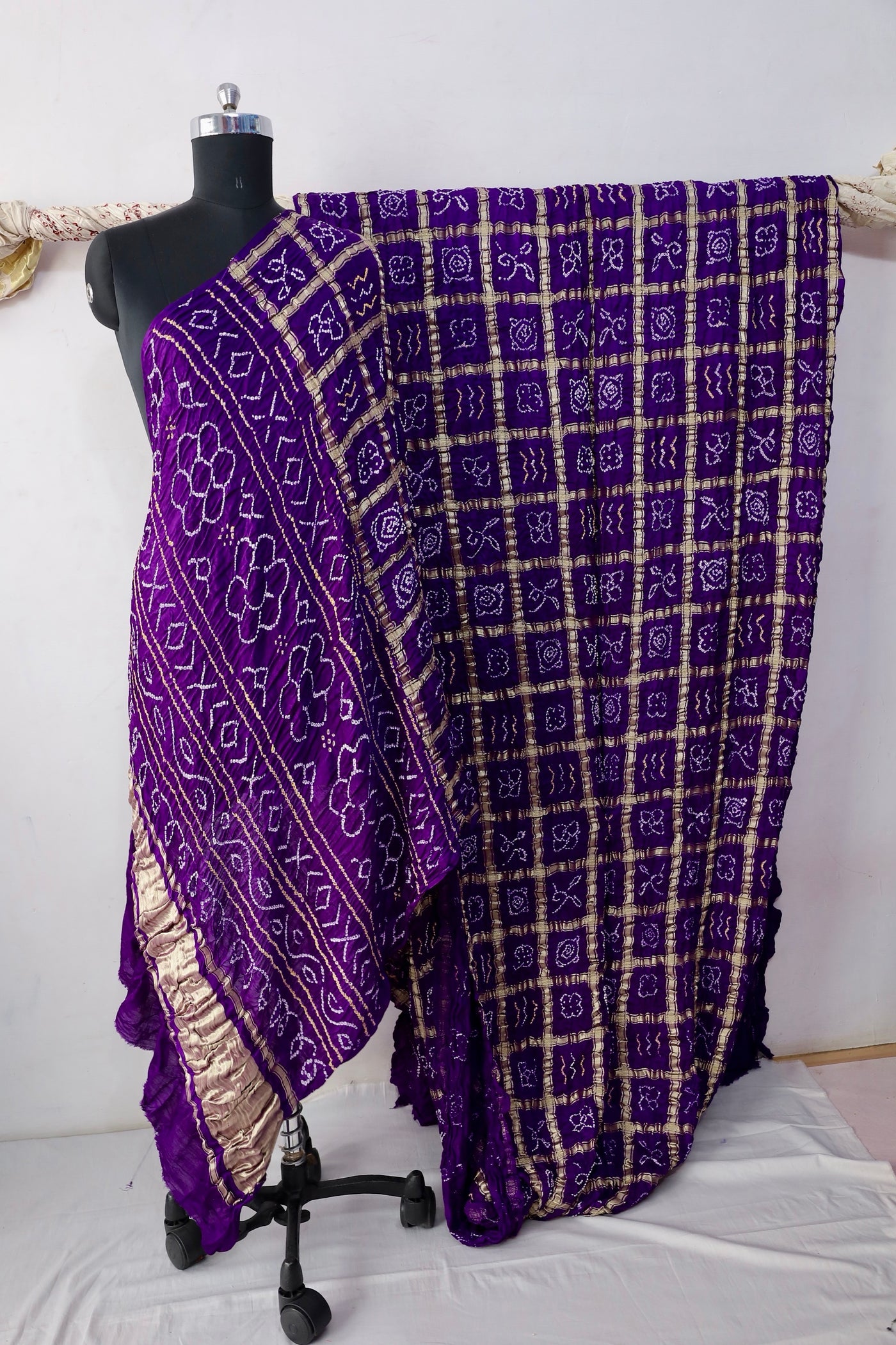 Royal Bandhani Gharchola Gajji silk saree featuring traditional tie-dye motifs and heritage-inspired checked patterns