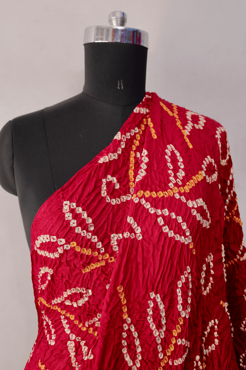 Ruby red Bandhani modal silk dupatta featuring traditional tie-dye craftsmanship and elegant drape
