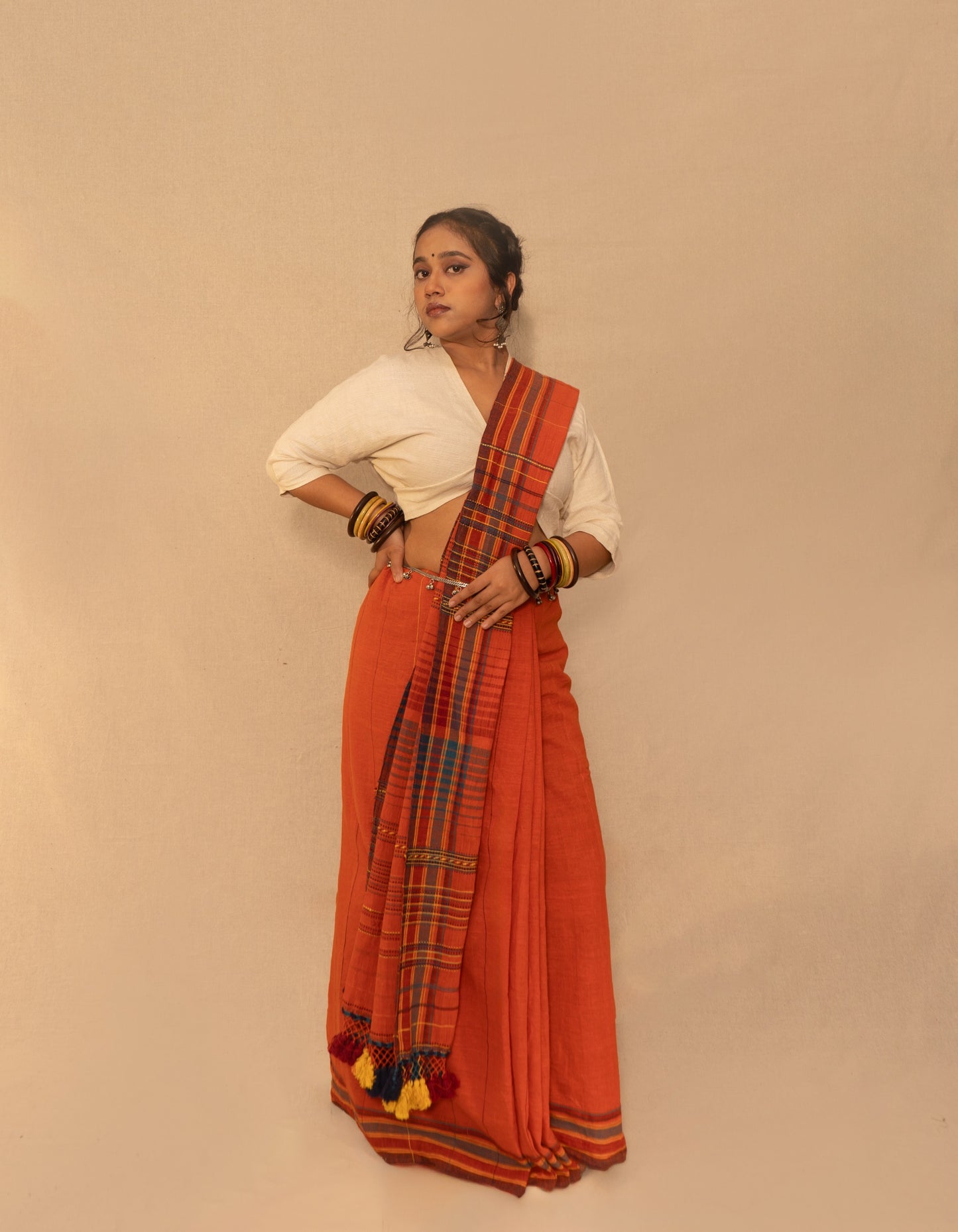 Rust Kala Cotton Bhujodi saree featuring traditional handwoven patterns and artisanal craftsmanship