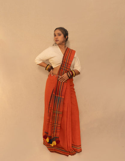 Rust Kala Cotton Bhujodi saree featuring traditional handwoven patterns and artisanal craftsmanship
