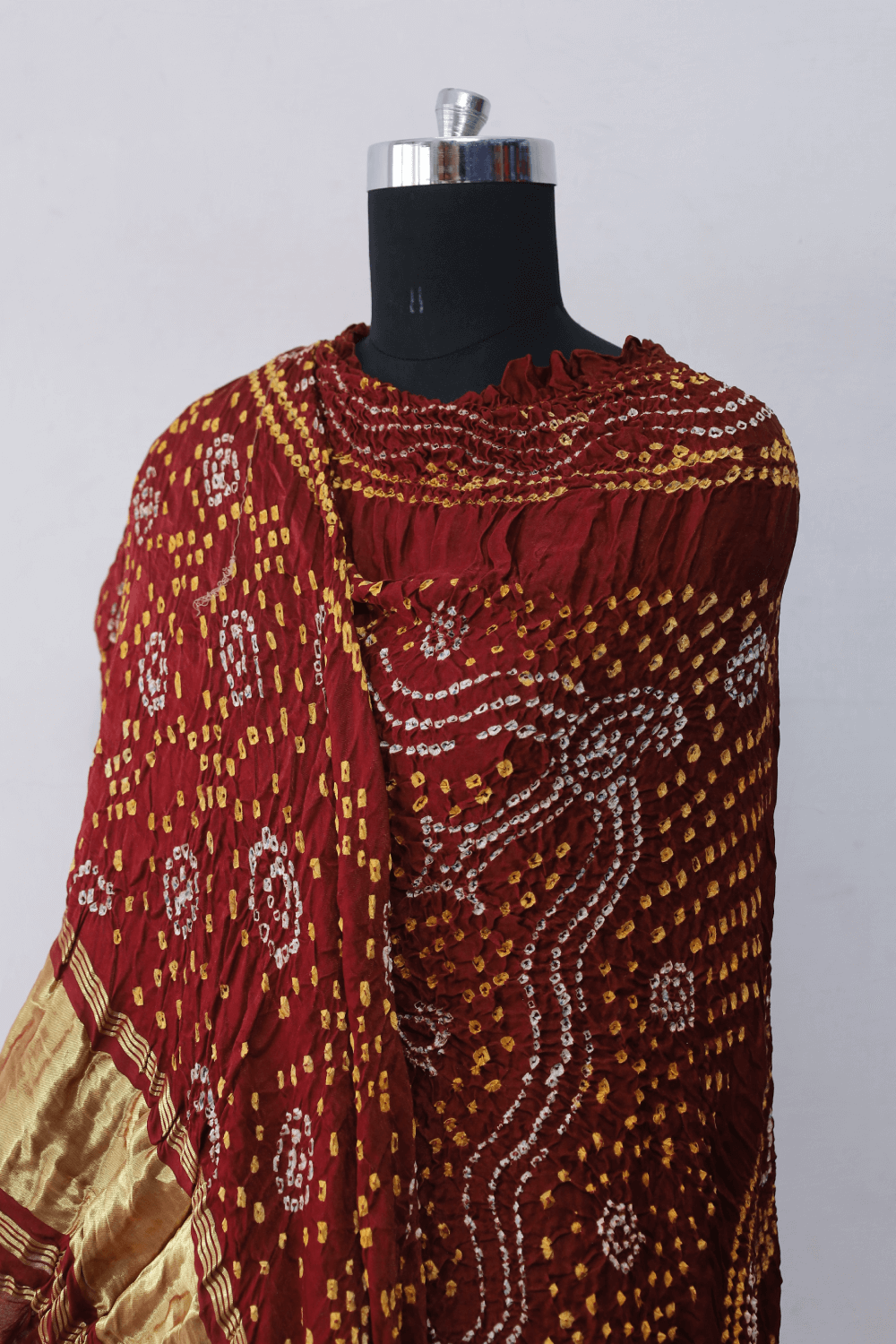 Traditional rust red Bandhani Gajji silk dupatta with intricate artisanal patterns