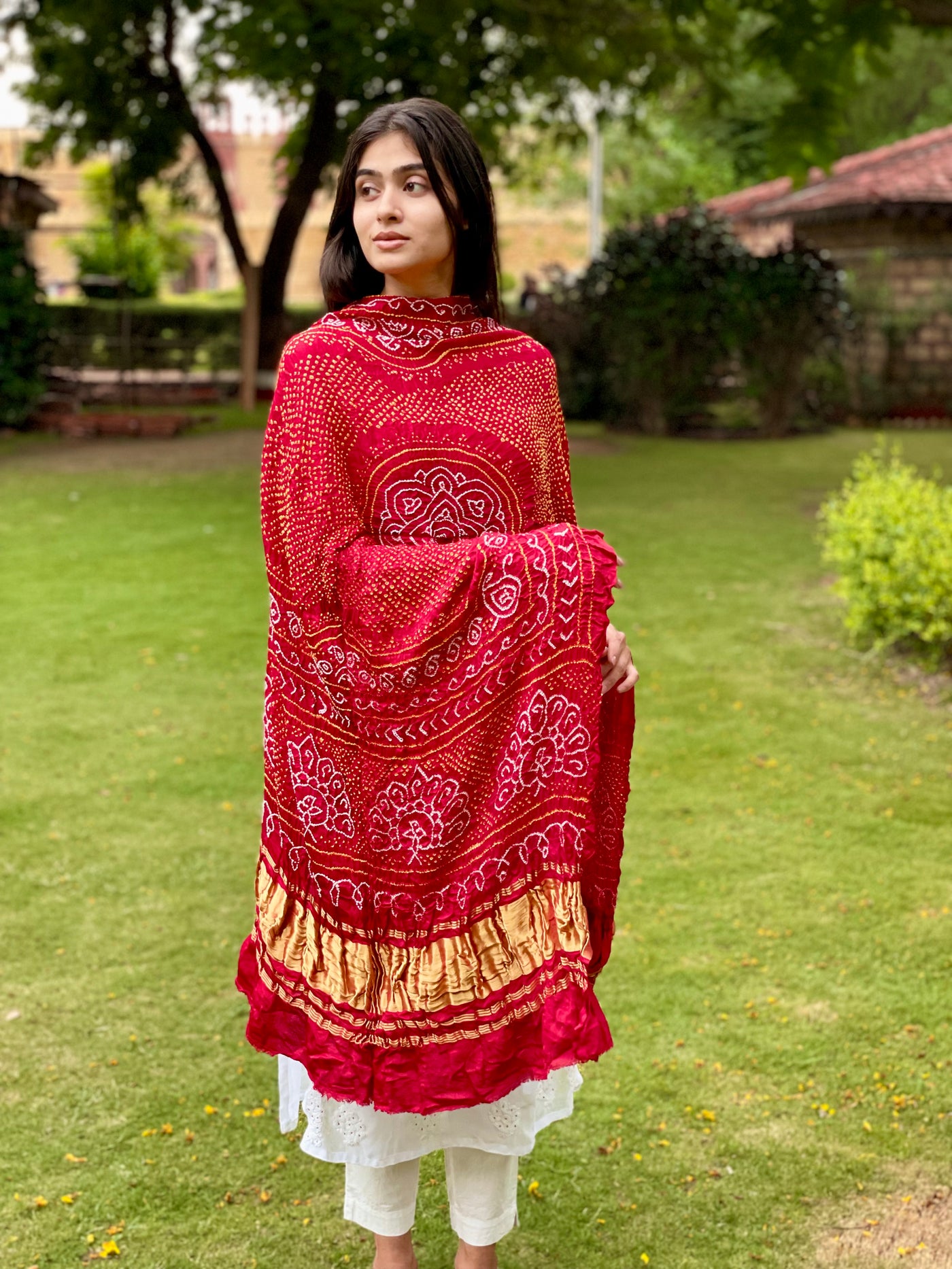 Rustic red Bandhani Gajji silk dupatta featuring traditional tie-dye craftsmanship and elegant drape