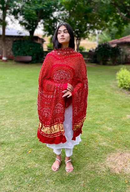 Traditional rustic red Bandhani Gajji silk dupatta with intricate artisanal patterns