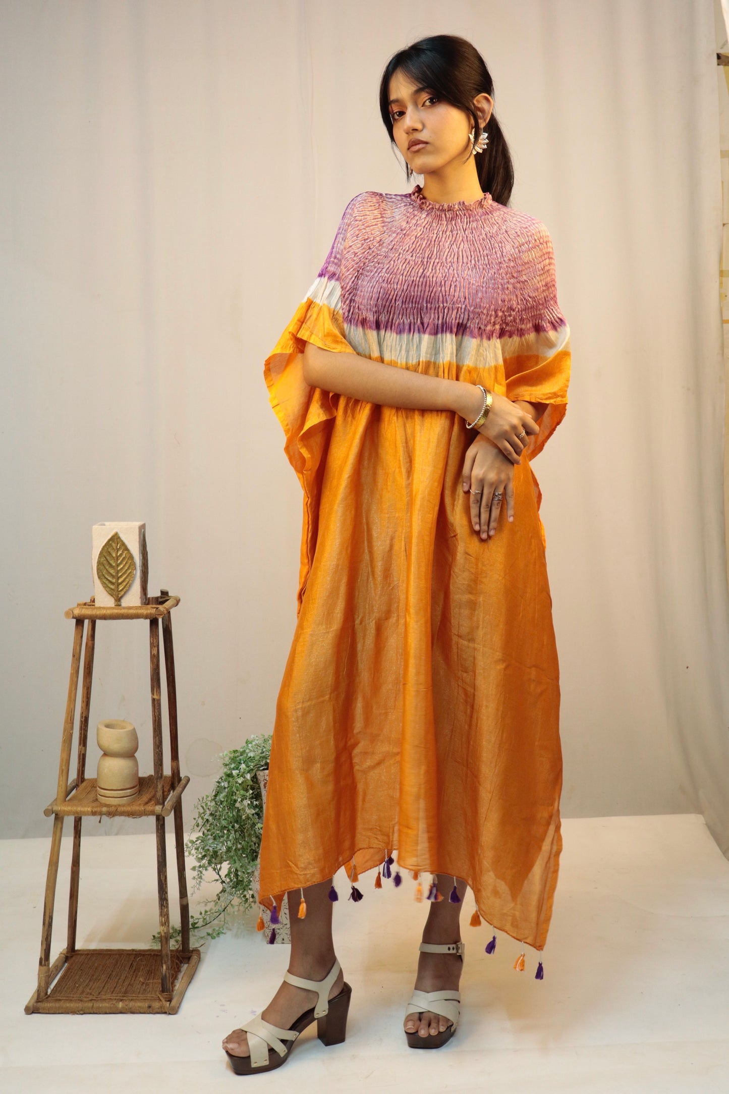 Saffron fade Bandhani Shibori silk kaftan showcasing intricate handcrafted resist-dye patterns and elegant drape