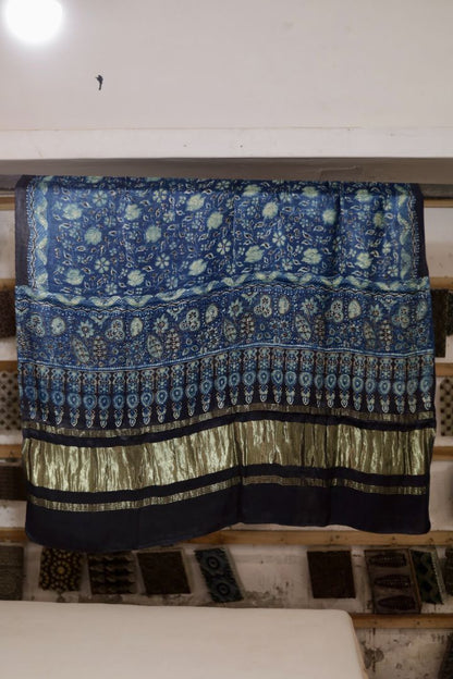 Sapphire blue Ajrakh modal silk dupatta with Lagdi Patta featuring intricate block printed motifs and elegant drape