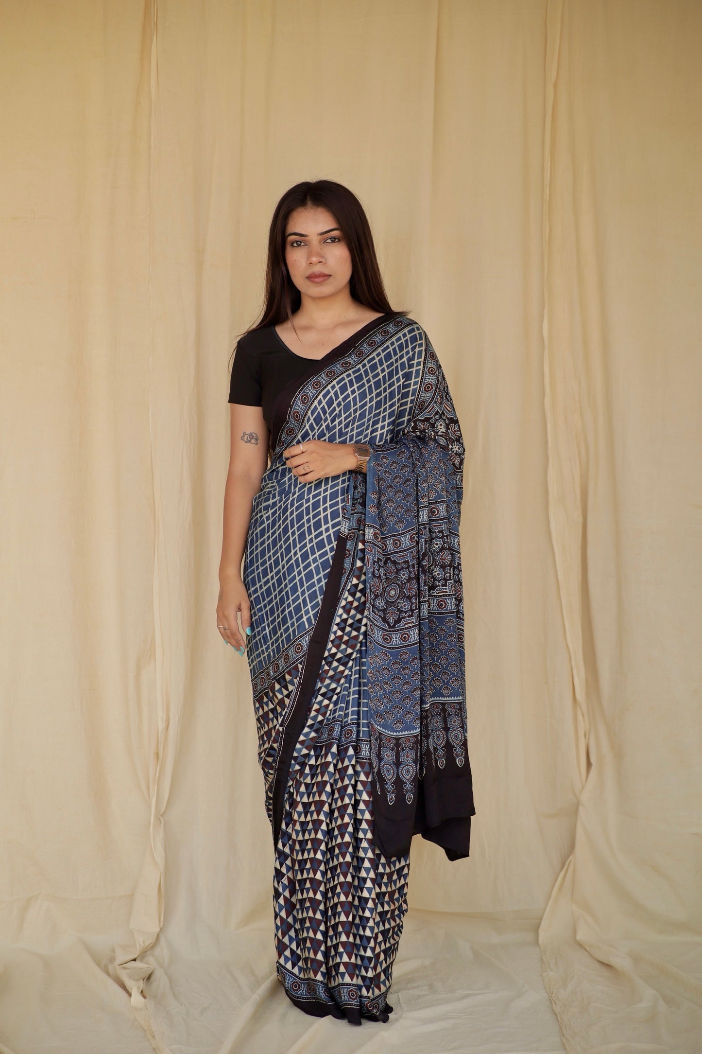 Sapphire blue Ajrakh modal silk saree featuring intricate hand block printed motifs and a graceful drape