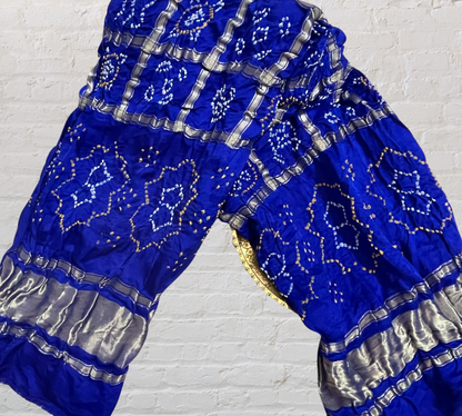 Handcrafted sapphire blue Gharchola dupatta featuring authentic Bandhani patterns and zari detailing