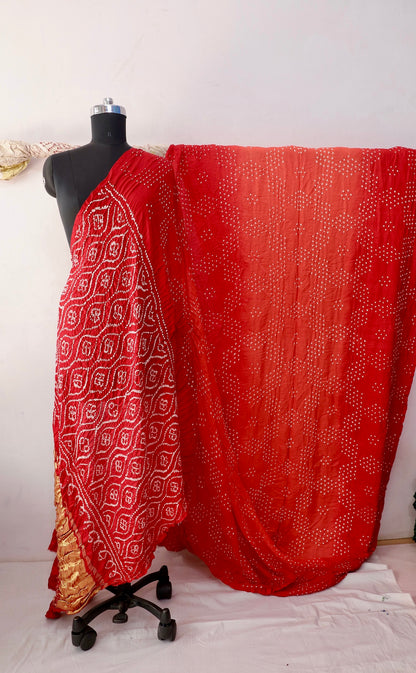 Scarlet Bandhani Gajji silk saree featuring intricate tie-dye patterns and an elegant zari pallu