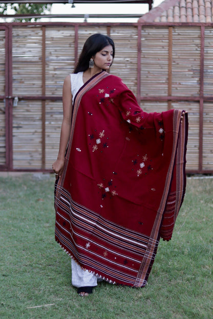 Scarlet red handwoven woolen shawl featuring a vibrant hue and exceptional artisan craftsmanship