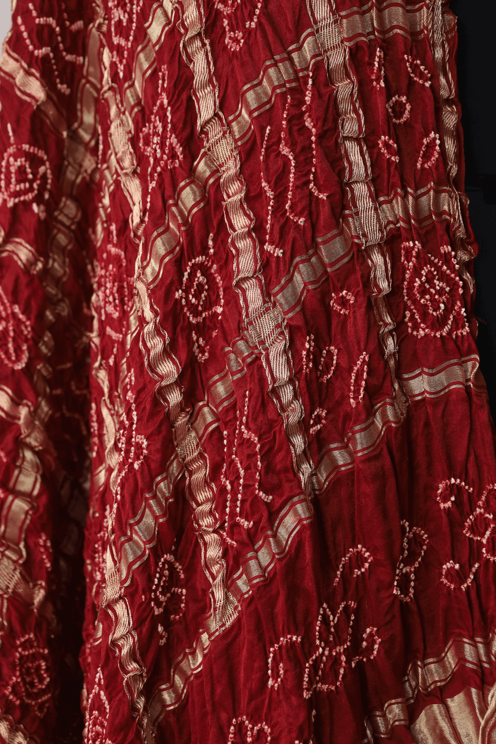 Vibrant scarlet red Bandhani Gharchola dupatta inspired by Gujarat's rich textile heritage