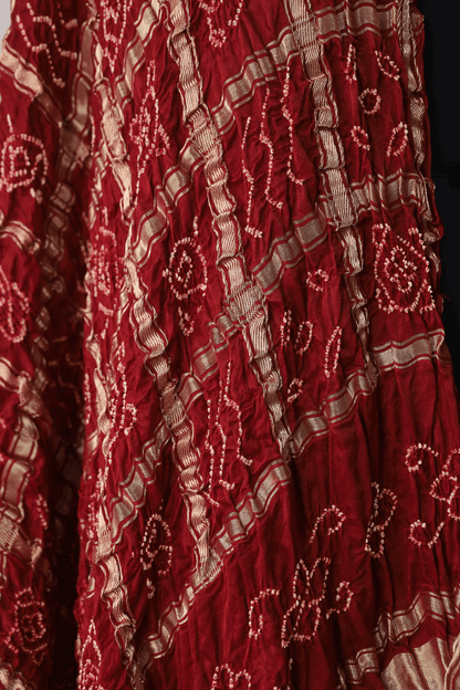 Vibrant scarlet red Bandhani Gharchola dupatta inspired by Gujarat's rich textile heritage