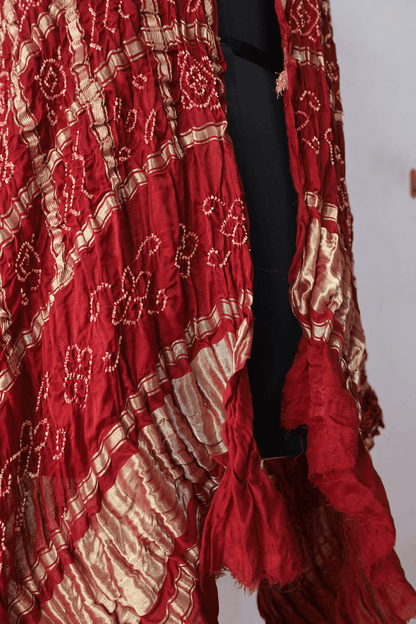 Handcrafted scarlet red Gharchola dupatta adorned with authentic Bandhani artistry