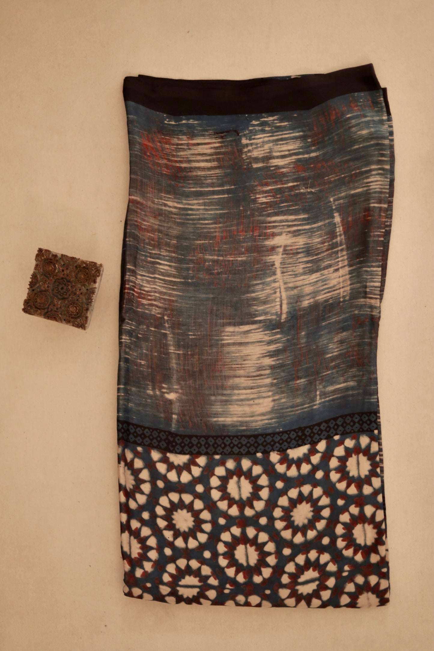 Smoky Ajrakh modal silk dupatta featuring intricate hand block printed motifs and elegant drape