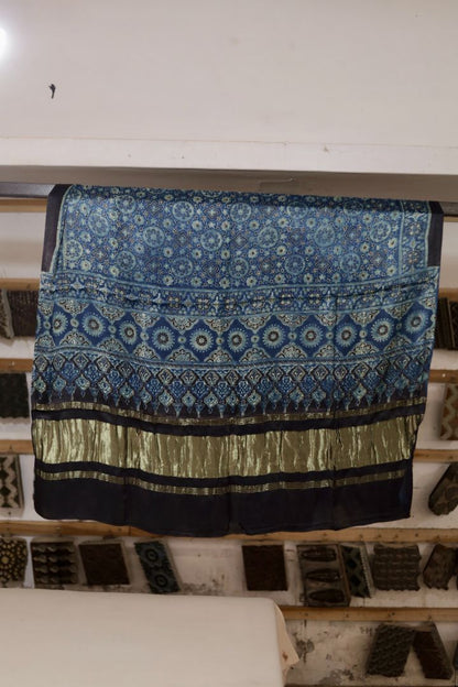Steel blue Ajrakh modal silk dupatta with Lagdi Patta featuring intricate block printed motifs and elegant drape