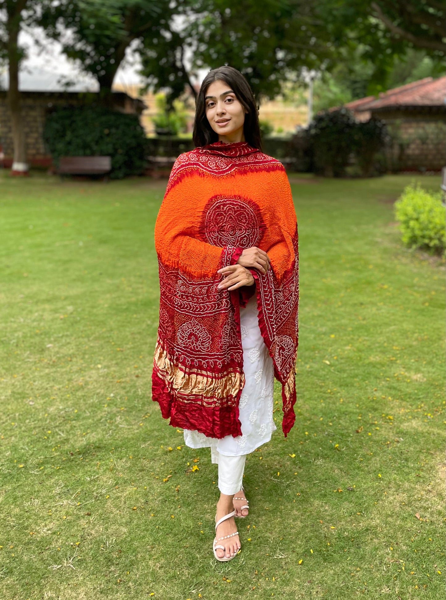 Tangerine and red Bandhani Gajji silk dupatta with traditional tie-dye patterns and elegant drape
