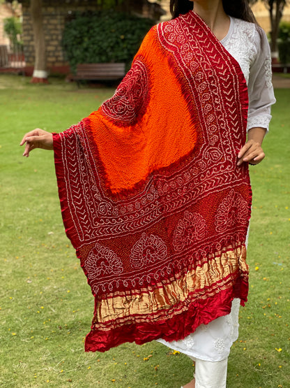 Ethnic Bandhani Gajji silk dupatta featuring intricate tie-dye design in red and tangerine