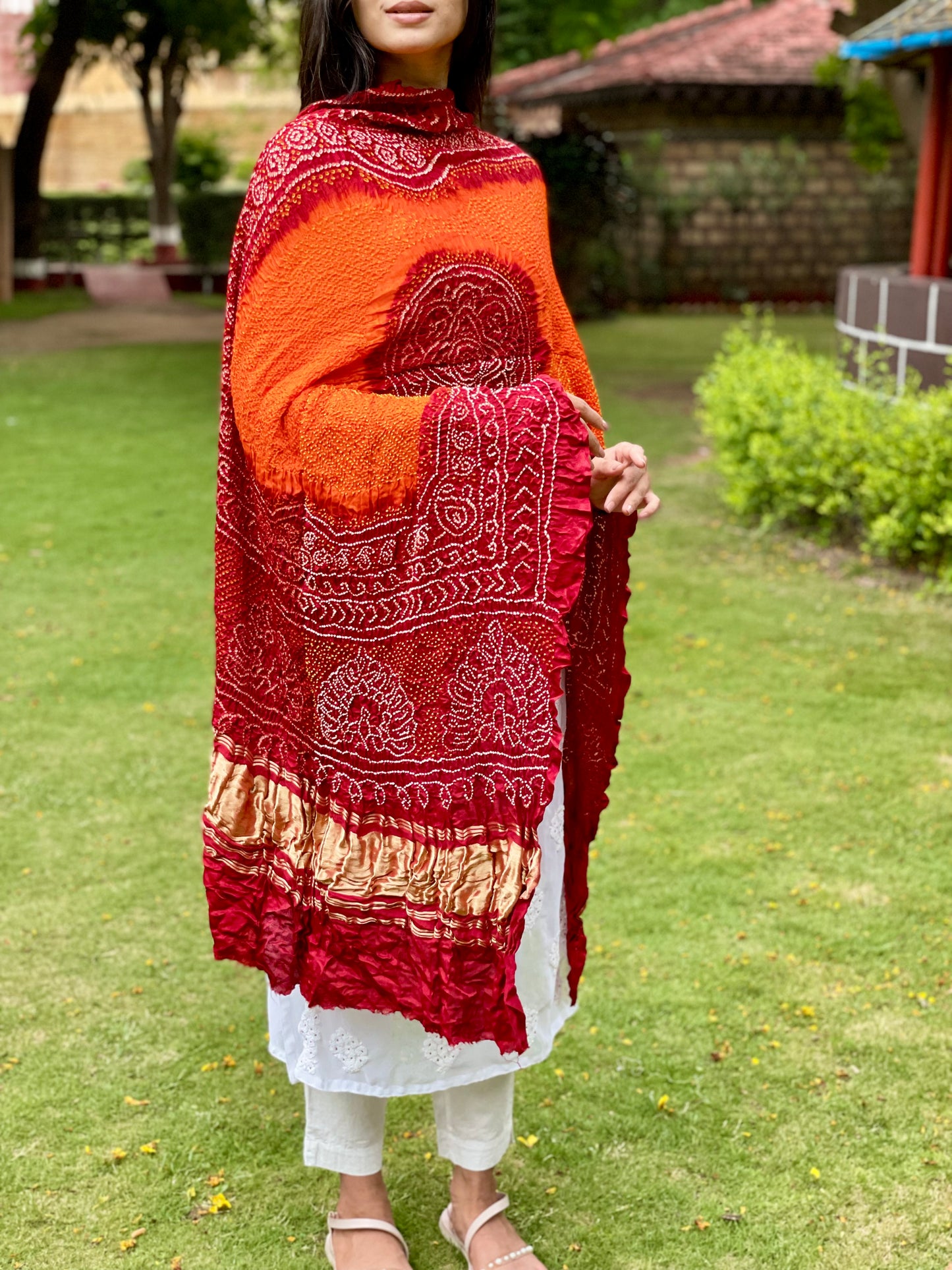 Traditional red and tangerine Bandhani dupatta made from luxurious Gajji silk fabric