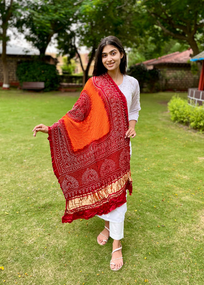 Handcrafted Bandhani Gajji silk dupatta in vibrant tangerine and red shades
