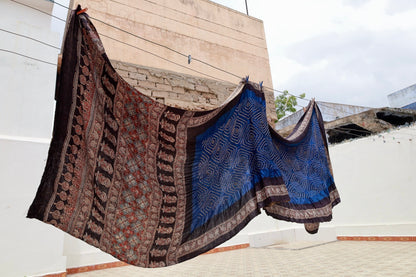 Teal Ajrakh Bandhani silk saree featuring intricate block-printed motifs and traditional tie-dye patterns