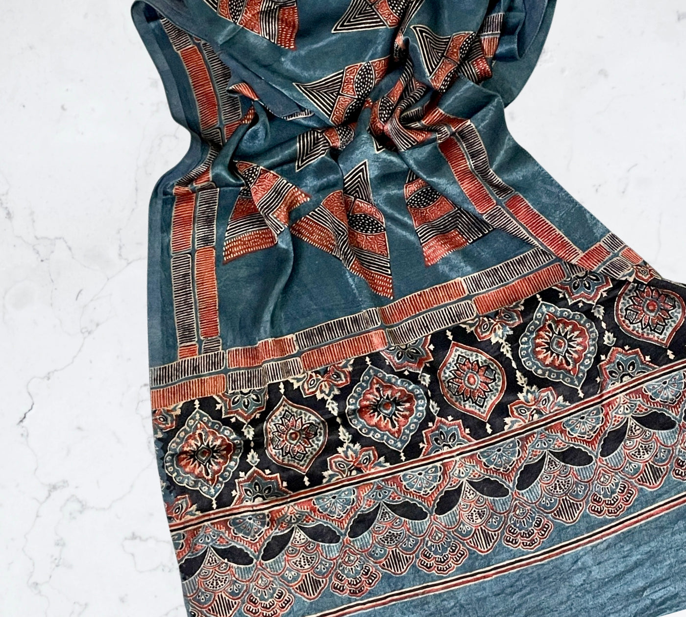Teal blue Ajrakh Mashru silk stole featuring intricate block printed motifs and elegant drape