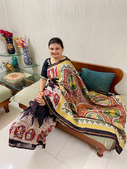 Handcrafted black Mata Ni Pachedi saree adorned with authentic handpainted designs inspired by Gujarat's folk art heritage